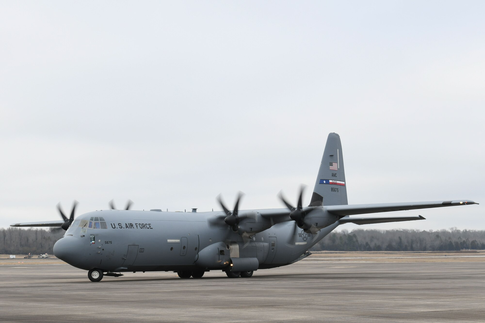 A C-130 taxis on the flightline