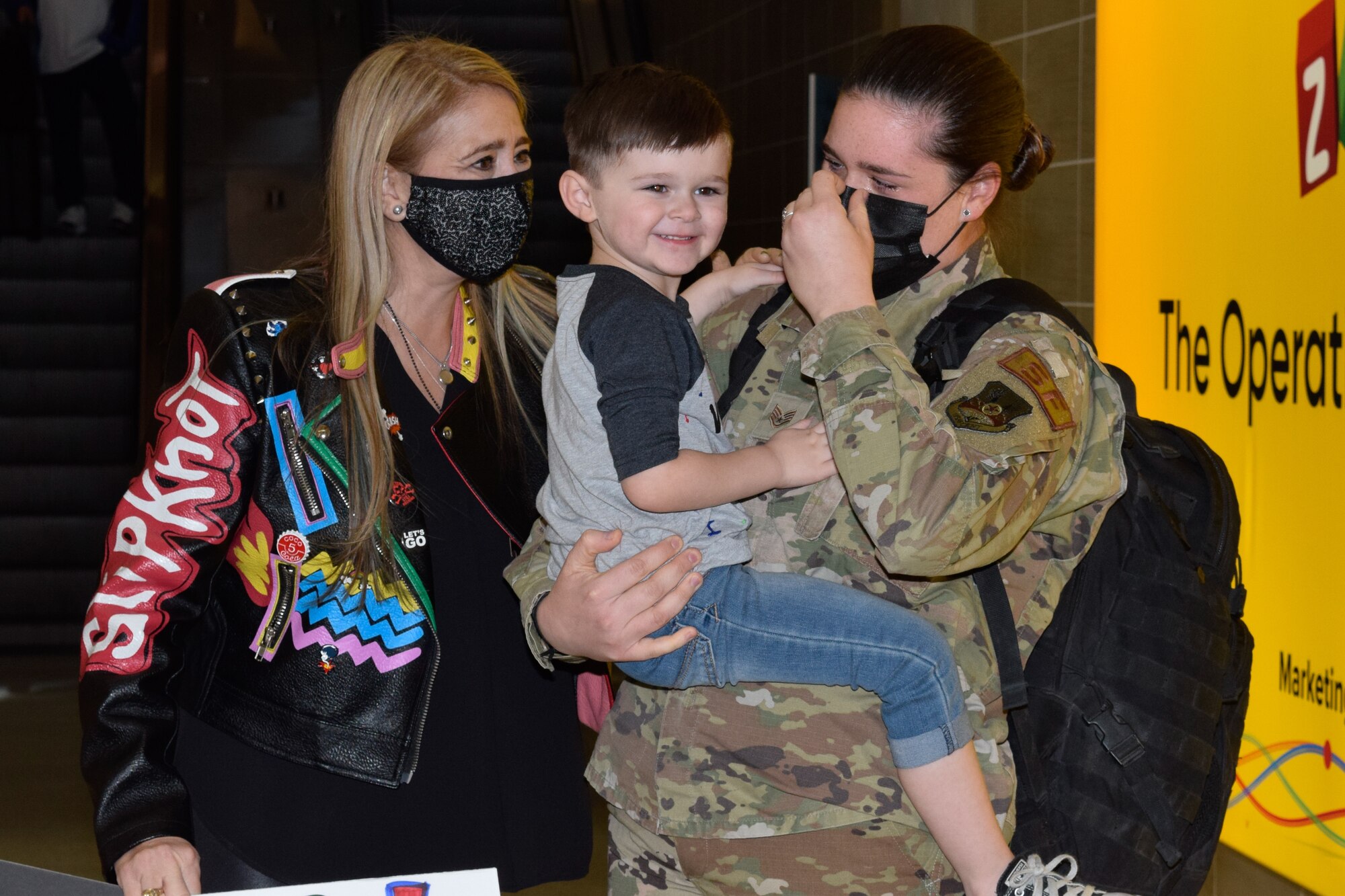 Staff Sgt. Venus Rich, 433rd Security Forces Squadron, reunites with her son, Kyle, and mother, Alicia Rich, at the airport in San Antonio Jan. 31, 2021. The 433rd SFS provided base security during a six-month deployment to Southwest Asia. (U.S. Air Force photo by Airman 1st Class Brittany Wich)