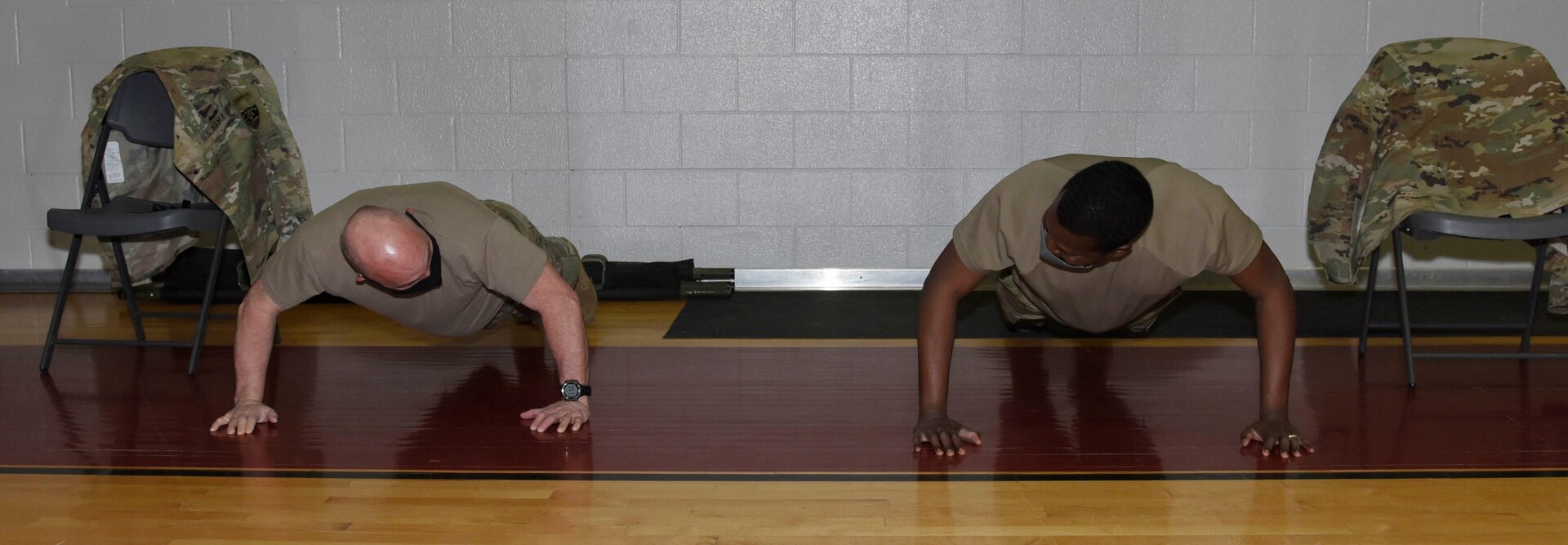 Members do push ups to keep arms loose following vaccination.