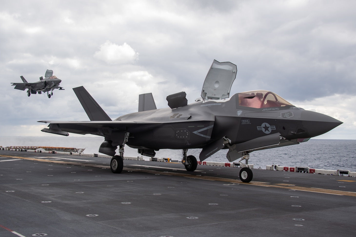 PHILIPPINE SEA (Jan. 10, 2021) F-35B Lightning II fighter aircraft assigned to the 31st Marine Expeditionary Unit (MEU) land on the flight deck of amphibious assault ship USS America (LHA 6). America, lead ship of the America Amphibious Ready Group, along with the 31st MEU, is operating in the U.S. 7th Fleet area of responsibility to enhance interoperability with allies and partners and serve as a ready response force to defend peace and stability in the Indo-Pacific region. (U.S. Navy photo by Mass Communication Specialist 3rd Class Jonathan D. Berlier)