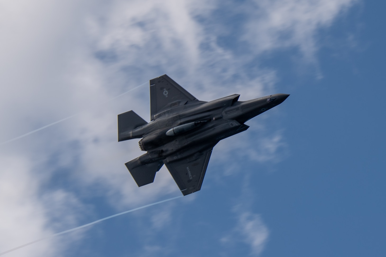 210130-N-BT681-1147 PHILIPPINE SEA (Jan. 30, 2021) An F-35B Lightning II assigned to the 31st Marine Expeditionary Unit (MEU) flies over the flight deck of the forward-deployed amphibious assault ship USS America (LHA 6). America, lead ship of the America Amphibious Ready Group, along with the 31st MEU, is operating in the U.S. 7th Fleet area of responsibility to enhance interoperability with allies and partners and serve as a ready response force to defend peace and stability in the Indo-Pacific region. (U.S. Navy photo by Mass Communication Specialist 3rd Class Jonathan D. Berlier)