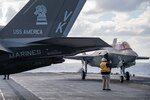 210130-N-BT681-1199 PHILIPPINE SEA (Jan. 30, 2021) An F-35B Lightning II assigned to the 31st Marine Expeditionary Unit (MEU) lands on the flight deck of amphibious assault ship USS America (LHA 6). America, lead ship of the America Amphibious Ready Group, along with the 31st MEU, is operating in the U.S. 7th Fleet area of responsibility to enhance interoperability with allies and partners and serve as a ready response force to defend peace and stability in the Indo-Pacific region. (U.S. Navy photo by Mass Communication Specialist 3rd Class Jonathan D. Berlier)