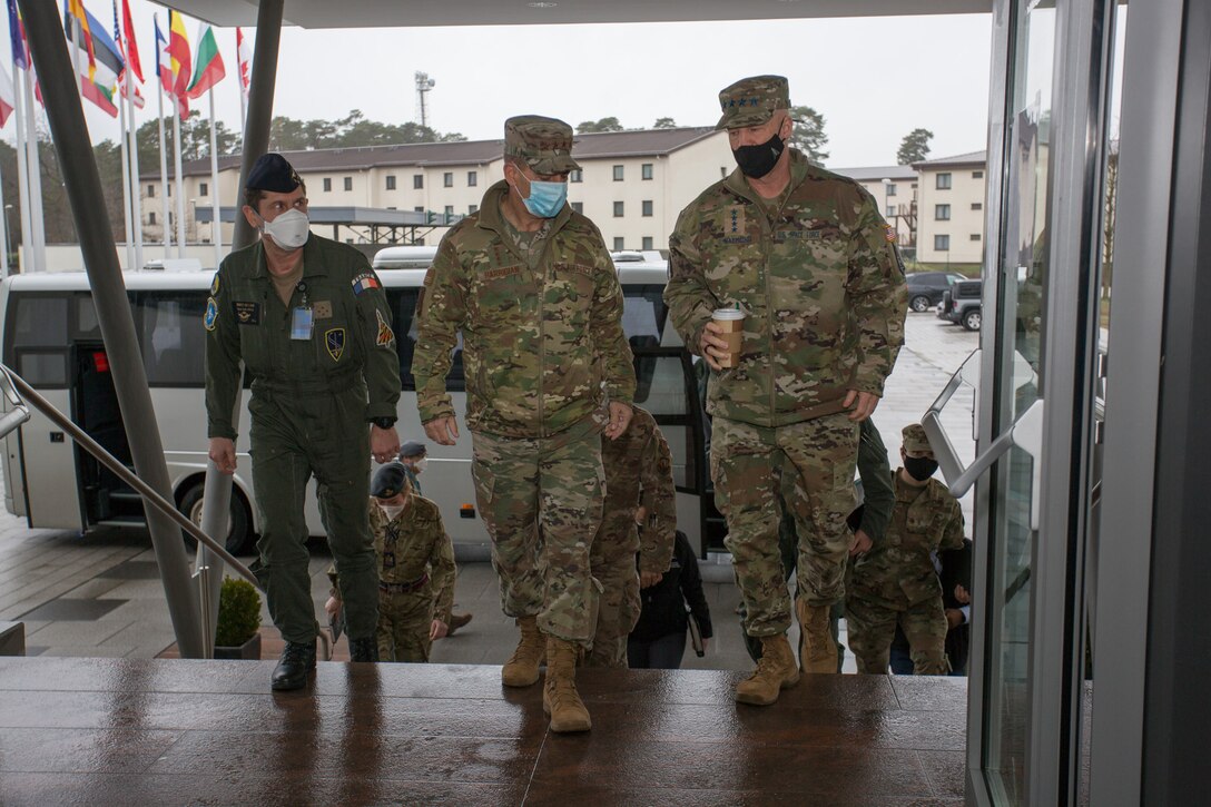 Generals walking into a building.