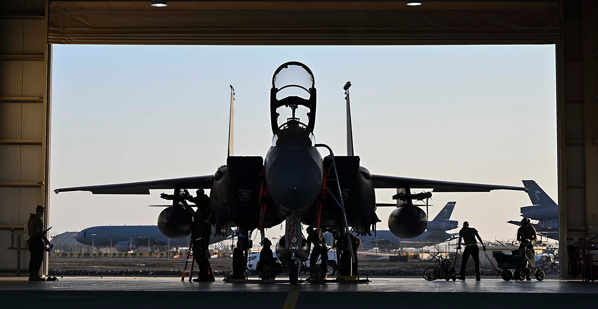 U.S. Air Force Airmen assigned to the 380th Expeditionary Aircraft Maintenance Squadron perform maintenance on an F-15E Strike Eagle at Al Dhafra Air Base, United Arab Emirates, Jan. 19, 2021.