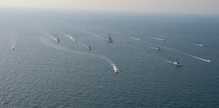 210124-N-XG173-1526 ARABIAN GULF (Jan. 24, 2021) Royal Saudi Naval Force ships and U.S. Navy sail in formation during exercise Nautical Defender (ND) 21 in the Arabian Gulf, Jan. 24. ND 21 is the capstone in a series of multi-national maritime security exercises designed to broaden levels of cooperation, support long-term regional security, and enhance military-to-military interoperability between the Kingdom of Saudi Arabia, UK and the U.S. (U.S. Navy photo by Mass Communication Specialist 2nd Class Aja Bleu Jackson)