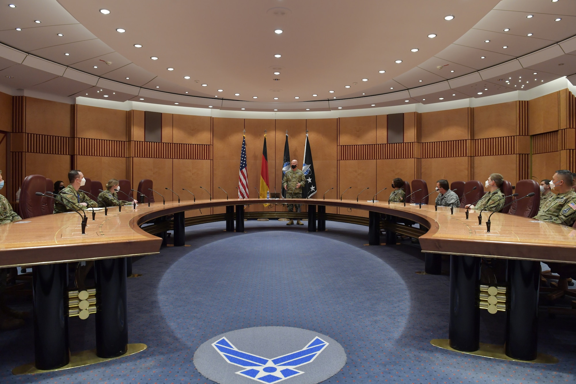 Airmen and Guardians sitting around a conference table.