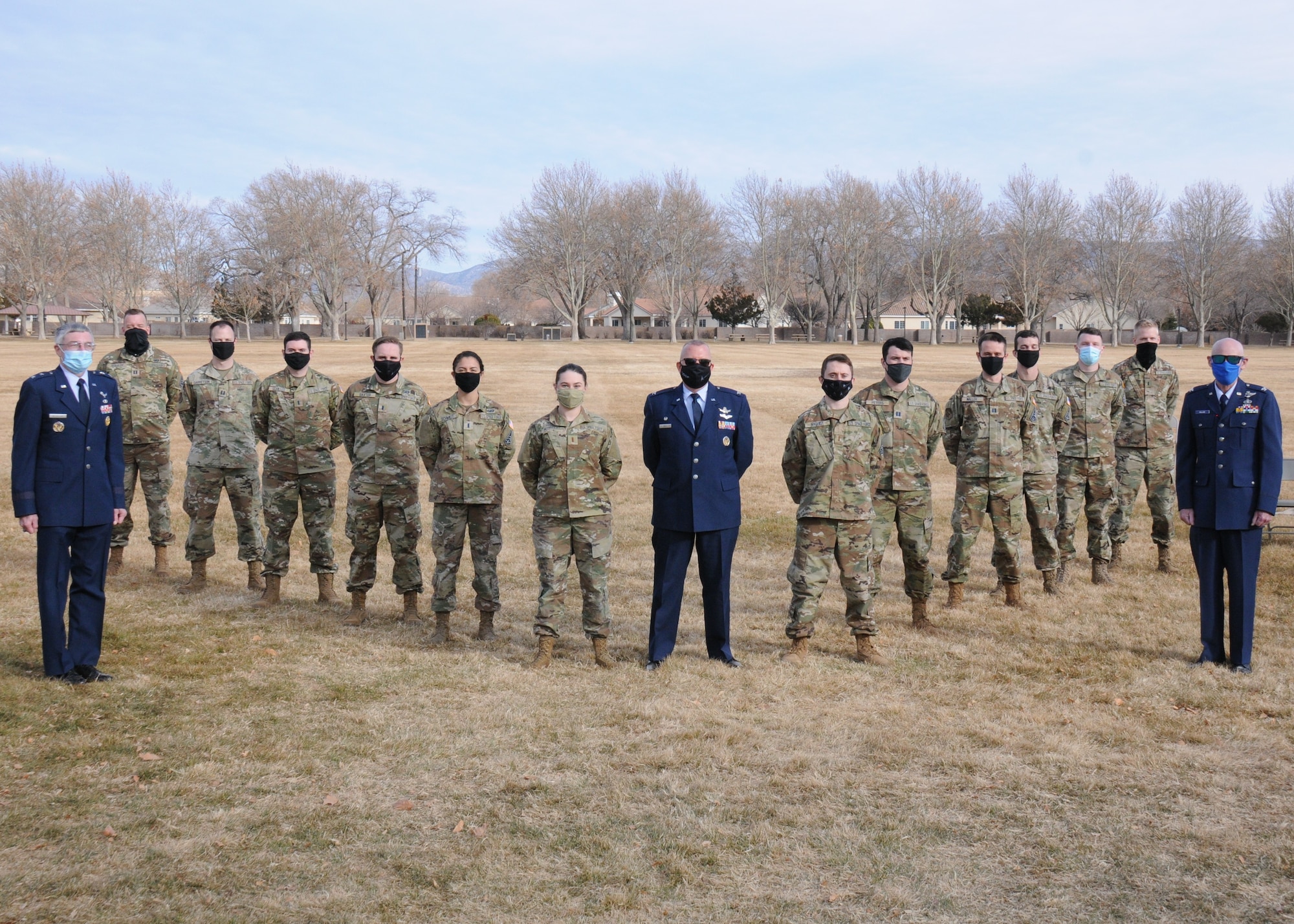 The Air Force Research Laboratory held an induction ceremony to transfer 13 officers from the U.S. Air Force into the U.S. Space Force Feb. 1, at Kirtland AFB, N.M. Col. Eric Felt, director of AFRL's Space Vehicles Directorate (center), presided over the event with distinguished guest speakers, Maj. Gen. William N. McCasland, USAF (ret.) (left) and Col. Mike Mullane, USAF (ret.) (right), both of whom administered the oath of office to the new Space Force Guardians. (U.S. Air Force photo/John Michael Cochran)