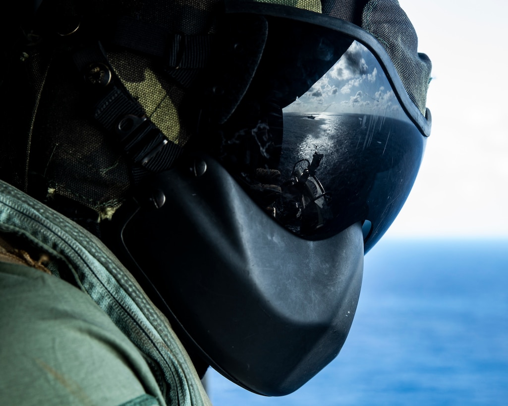 A U.S. Marine observes a Visit, Board, Search and Seizure mission in the Philippine Sea, Jan. 24.