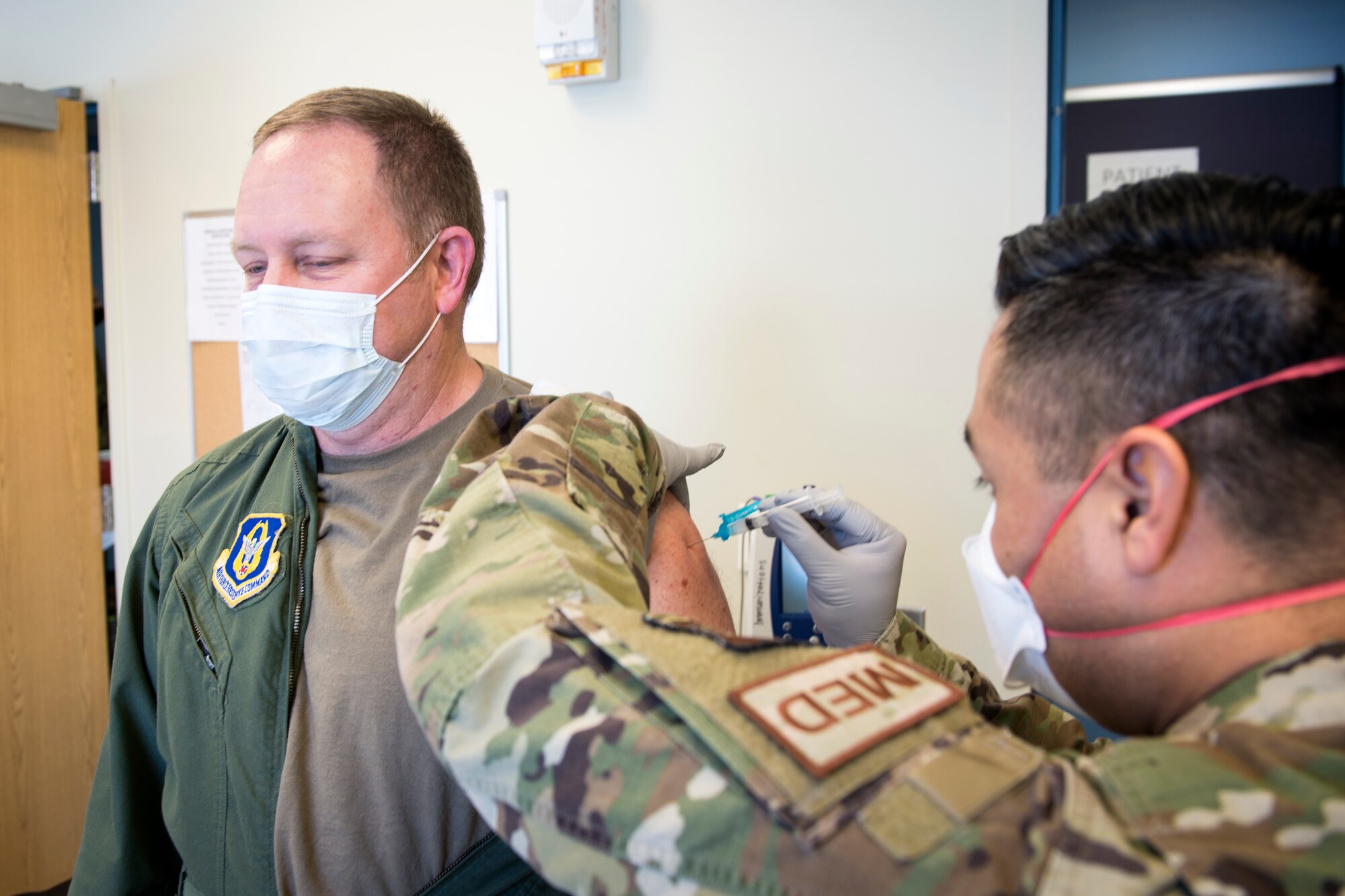 Col. (Dr.) Bill Bray, 434th Aerospace Medicine Squadron flight surgeon, receives the Moderna COVID-19 vaccine at Grissom Air Reserve Base, Ind., Feb. 1, 2021. Bray was the first member at Grissom to receive the vaccine through the 434th AMDS clinic. (U.S. Air Force photo/Master Sgt. Ben Mota)