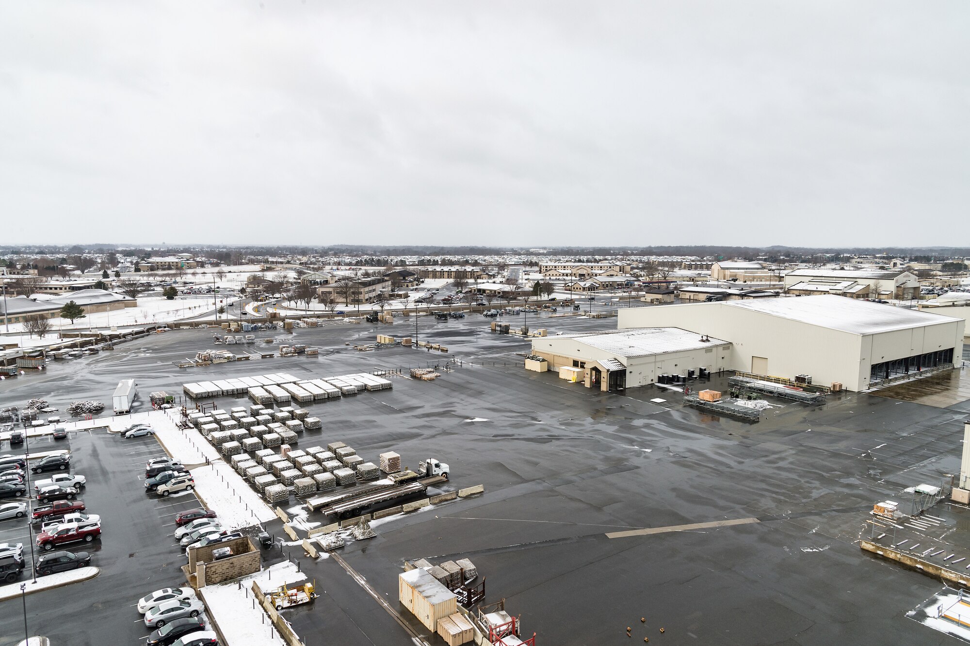 A view from the air traffic control tower of the 436th Aerial Port Squadron’s marshaling yard after a nor’easter produced snow showers at Dover Air Force Base, Delaware, Feb. 2, 2021. As snow fell, the base continued normal operations and prepared for additional forecast snowfall during the next day. (U.S. Air Force photo by Roland Balik)