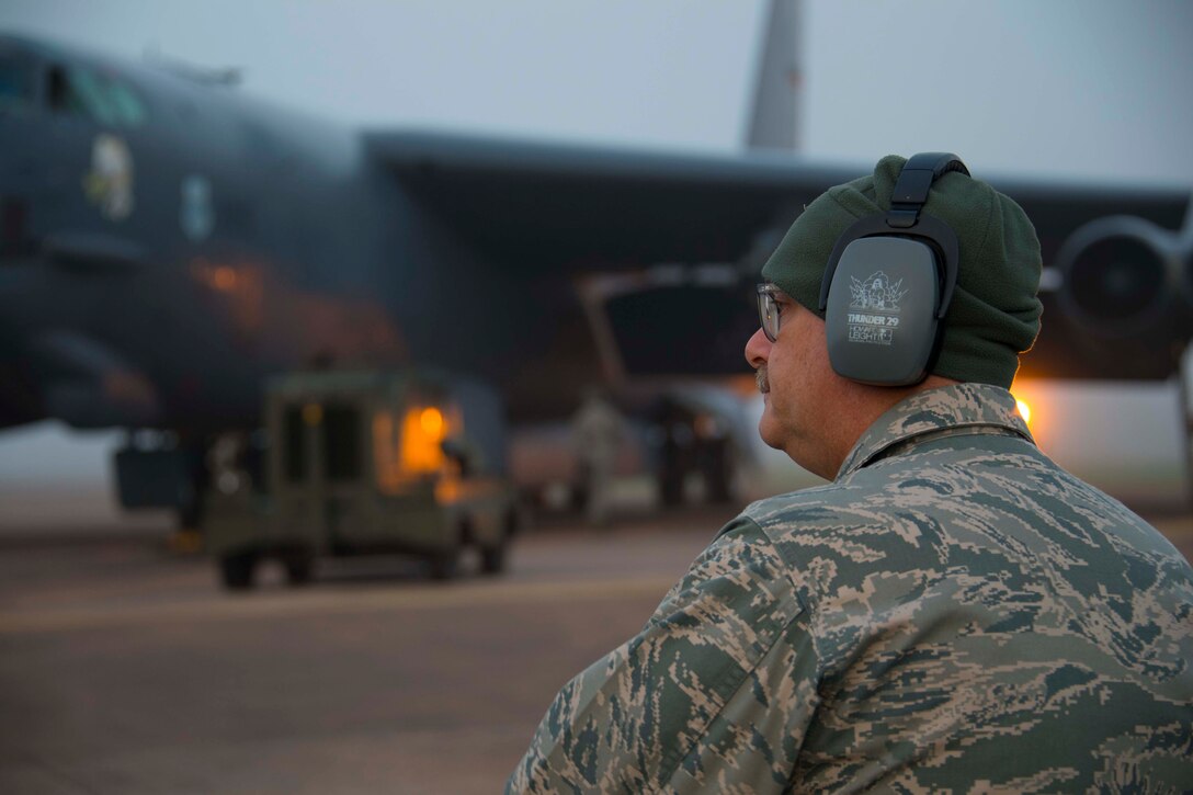 Photo of Airman looking at a plane