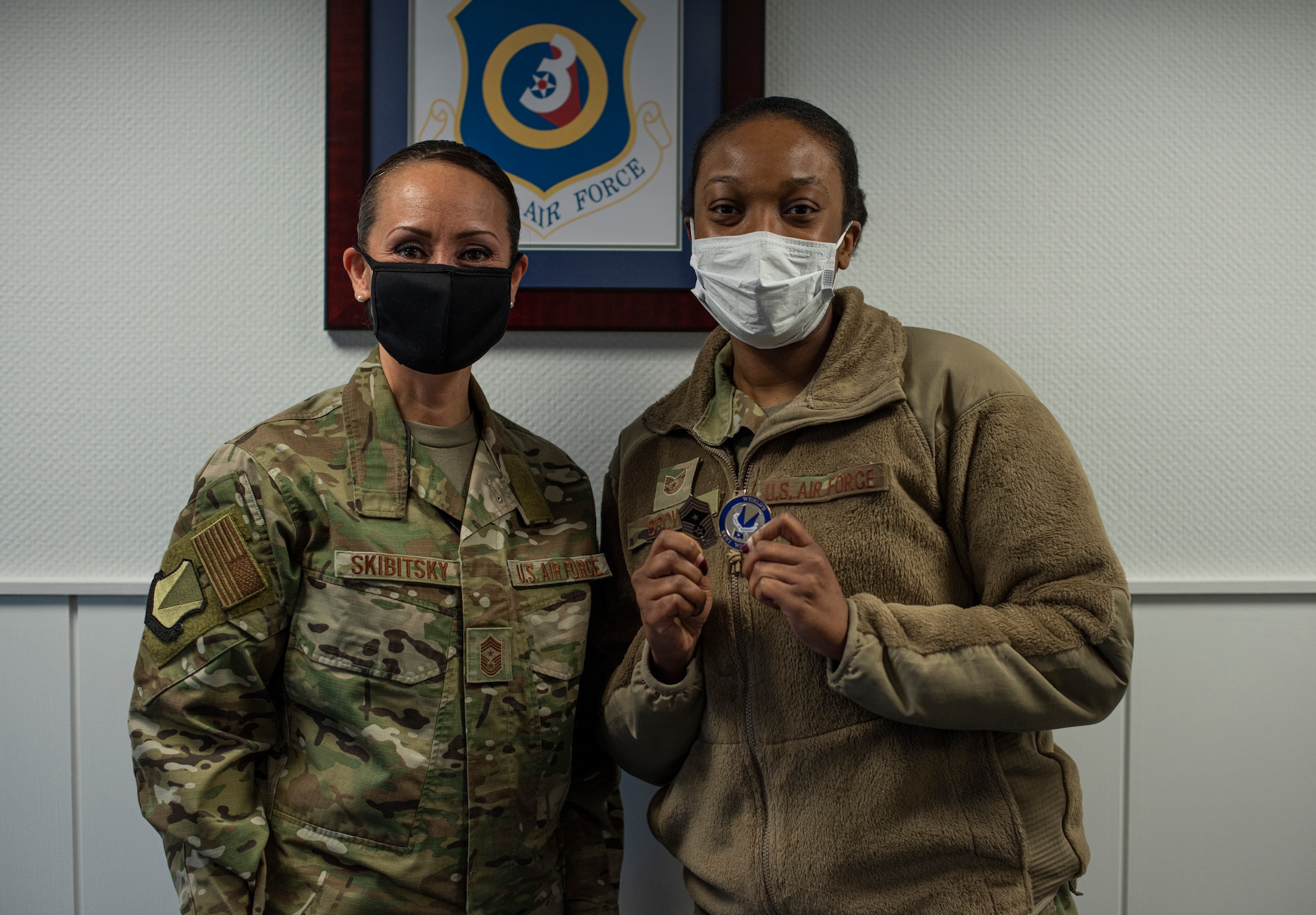 U.S. Air Force Tech. Sgt. Tamara Brown, 86th Medical Support Squadron patient administration section chief, stands with 86th Airlift Wing Command Chief Master Sgt. Hope Skibitsky, at Ramstein Air Base, Germany, Jan. 28, 2021.