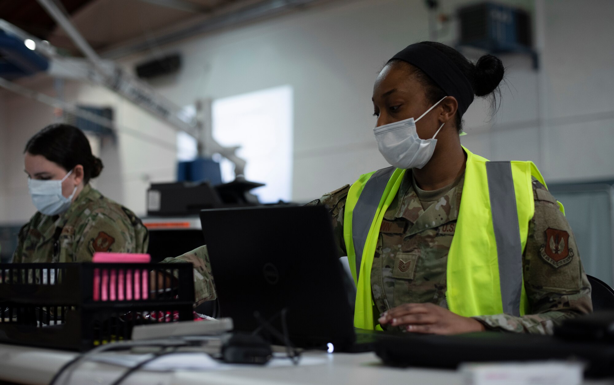 Brown makes sure medical records for Airmen reflect their vaccination for COVID-19.