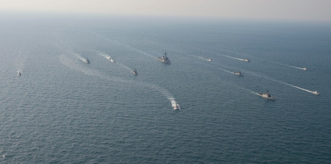 ARABIAN GULF (Jan. 24, 2021) Royal Saudi Naval Force ships and U.S. Navy sail in formation during exercise Nautical Defender (ND) 21 in the Arabian Gulf, Jan. 24. ND 21 is the capstone in a series of multi-national maritime security exercises designed to broaden levels of cooperation, support long-term regional security, and enhance military-to-military interoperability between the Kingdom of Saudi Arabia, UK and the U.S. (U.S. Navy photo by Mass Communication Specialist 2nd Class Aja Bleu Jackson)