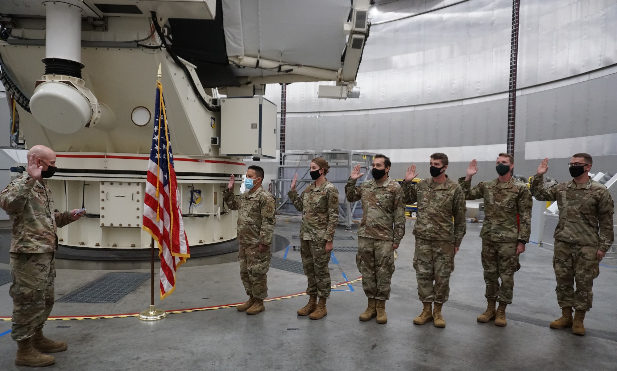 Lt. Col. John Zingarelli administers the oath of office to six Air Force Research Laboratory officers, commissioning them into the U.S. Space Force, in a ceremony held Feb. 1 at AFRL's Air Force Maui Optical and Supercomputing site on Maui. The ceremony was held at the Haleakala Summit, where the site conducts its telescope operations. (U.S. Air Force photo/Joshua Johnson)