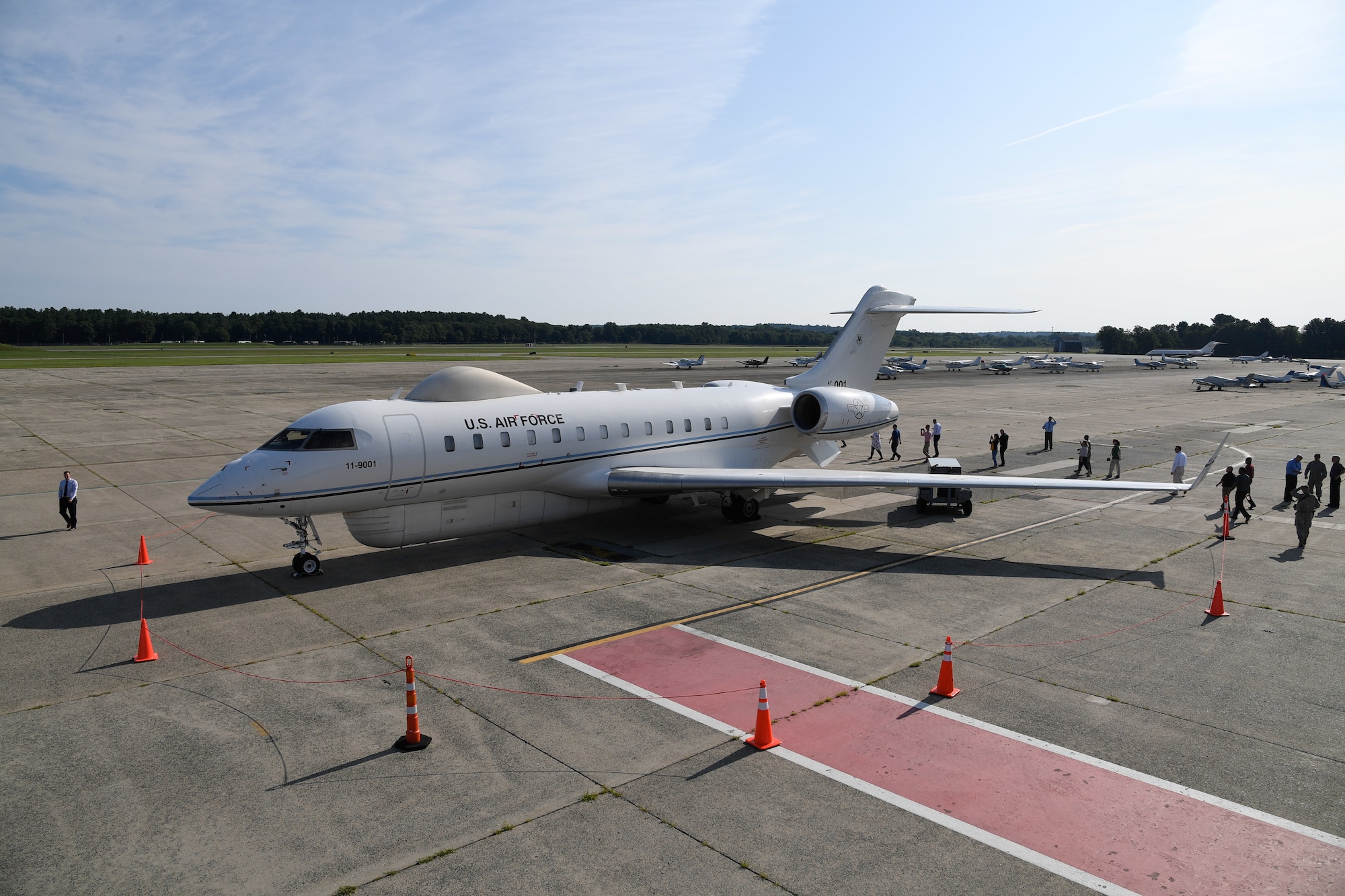 A Battlefield Airborne Communications Node-equipped E-11A aircraft rolls out on the flightline at Hanscom Air Force Base, Mass. in July 2018. BACN hardware provides military commanders with a long-range, over-the-horizon secure communication capability that connects troops to combat pilots, despite adverse terrain or distance, often when terrestrial services are either restricted or unavailable. (U.S. Air Force photo by Mark Herlihy/Released)