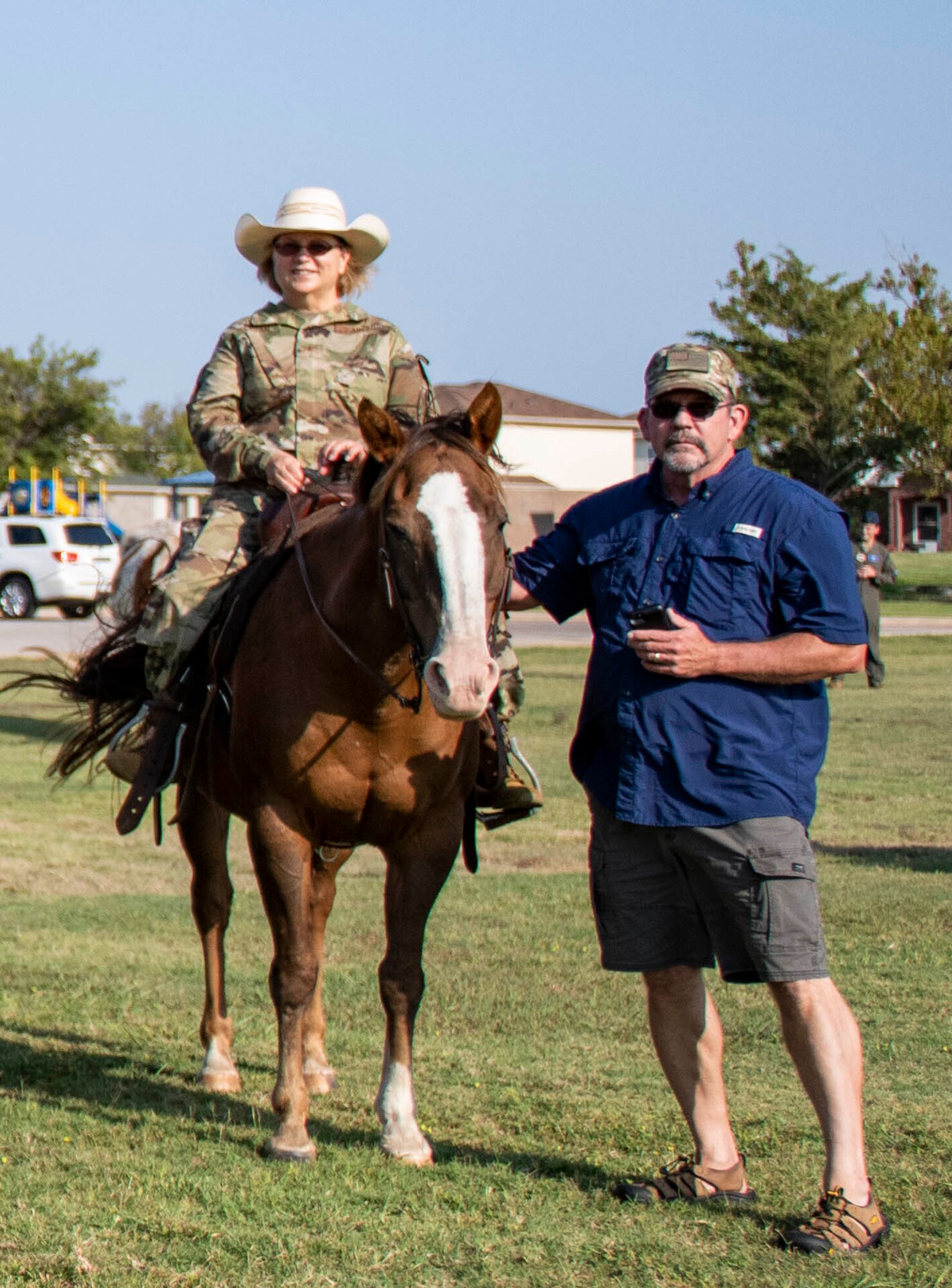 Col Judy Rattan, the 97th Medical Group commander, and her husband, Chris Rattan, pose for a photo during the annual cattle drive.