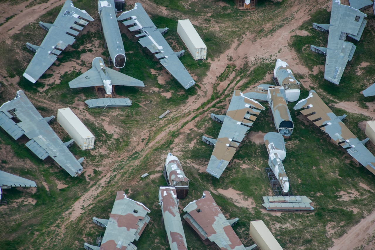 An aerial photo shows chopped-up bombers in the desert.