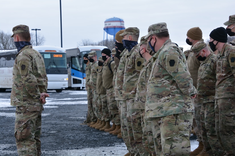Soldiers and Airmen of the Pennsylvania National Guard’s Task Force Panther, a 450-member multi-service task force established to assist federal law enforcement in Washington, D.C., stand in formation prior to departing Fort Indiantown Gap, Pennsylvania, Feb. 3.
