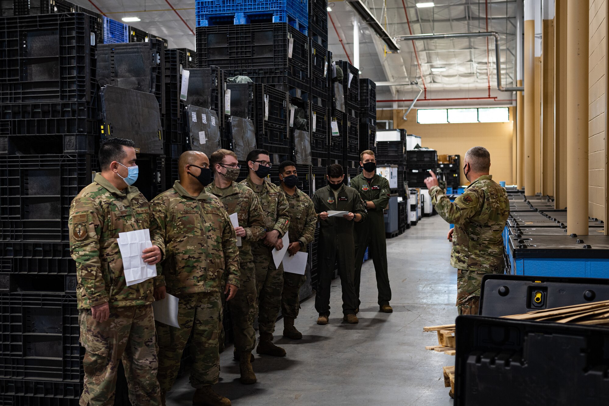 Photo of an Airman explaining gear-issue procedures