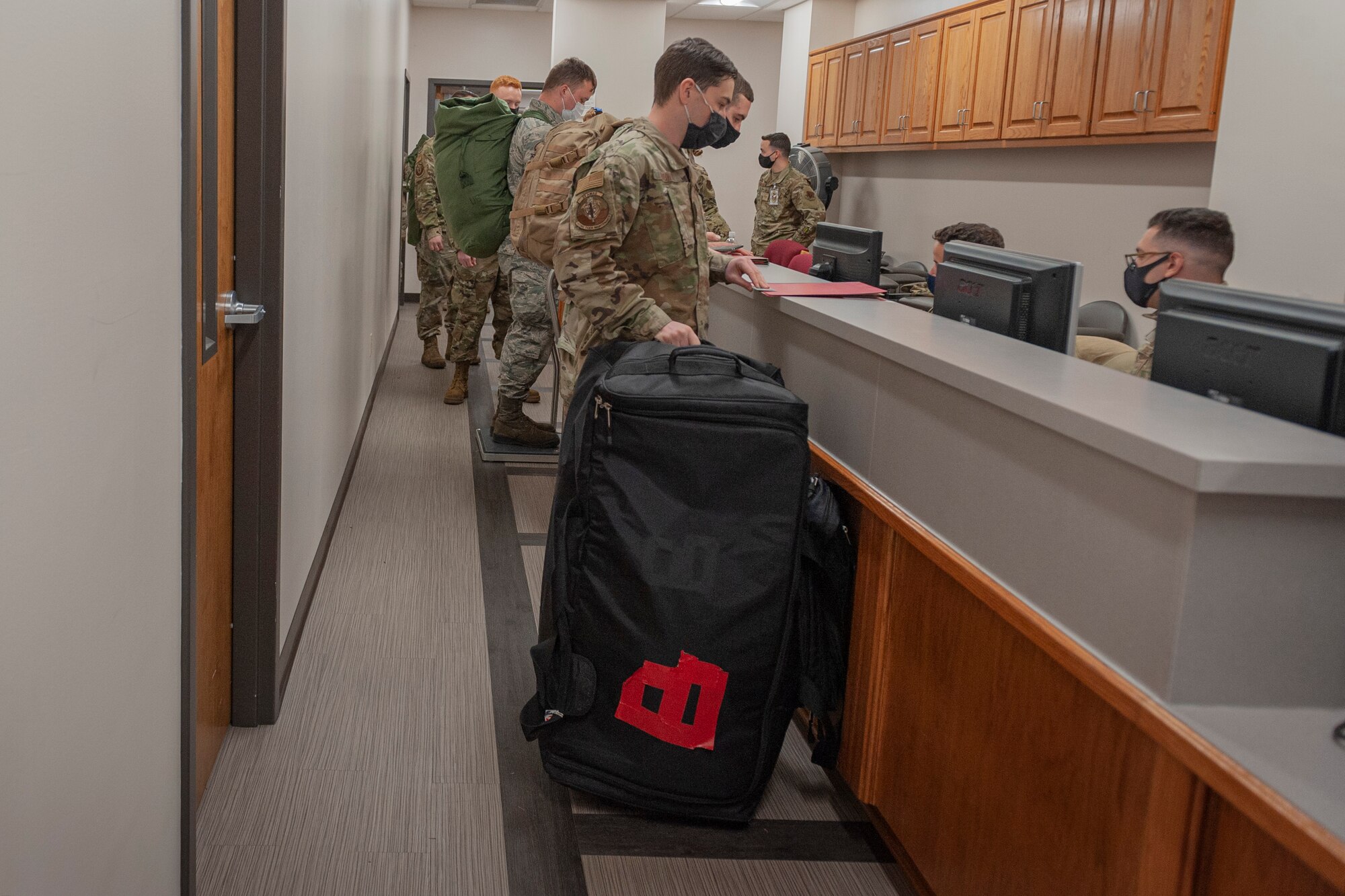 Photo of Airmen preparing for a simulated deployment