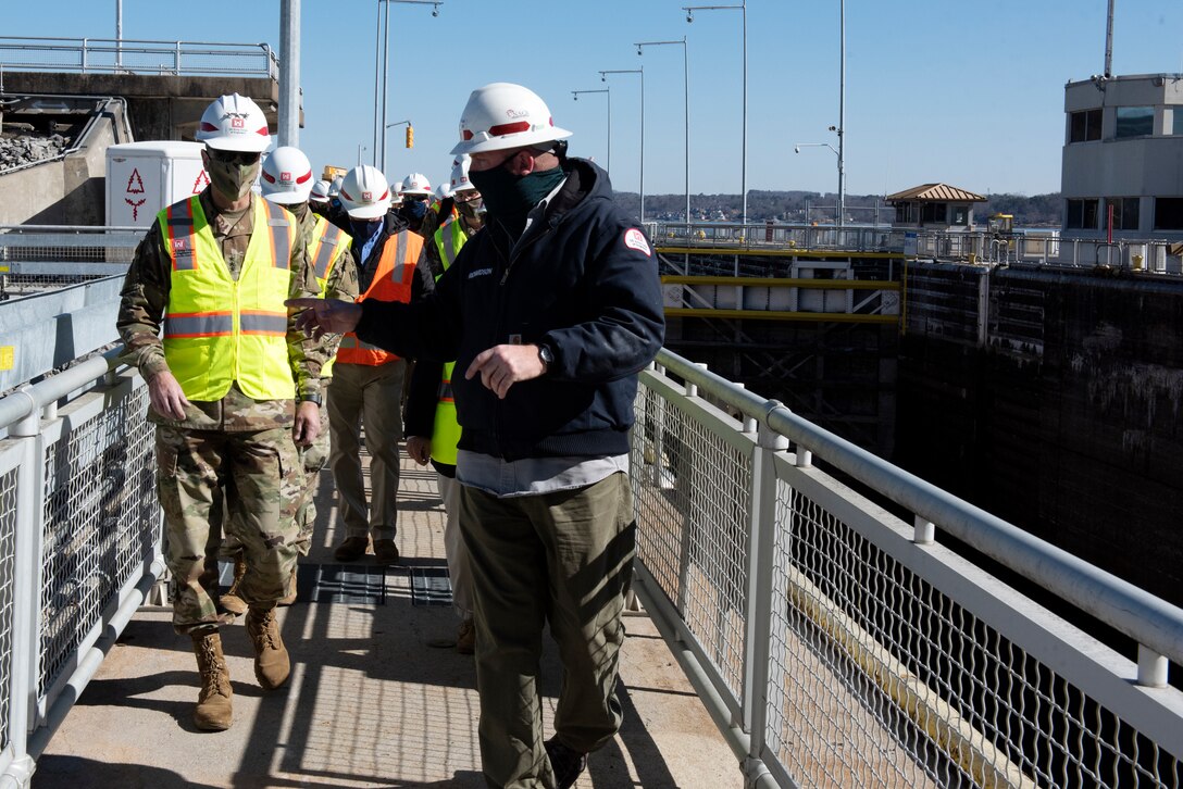 Cory Richardson, Chickamauga Lock master, leads Lt. Gen. Scott Spellmon, 55th chief of Engineers, on a tour of Chickamauga Lock on the Tennessee River in Chattanooga, Tennessee, Feb. 3, 2021. The lock has experienced structural problems and is also incompatible with today’s towing equipment resulting in longer than normal tow-processing times. The U.S. Army Corps of Engineers Nashville District is building a larger replacement lock at the Tennessee Valley Authority project. (USACE photo by Lee Roberts)