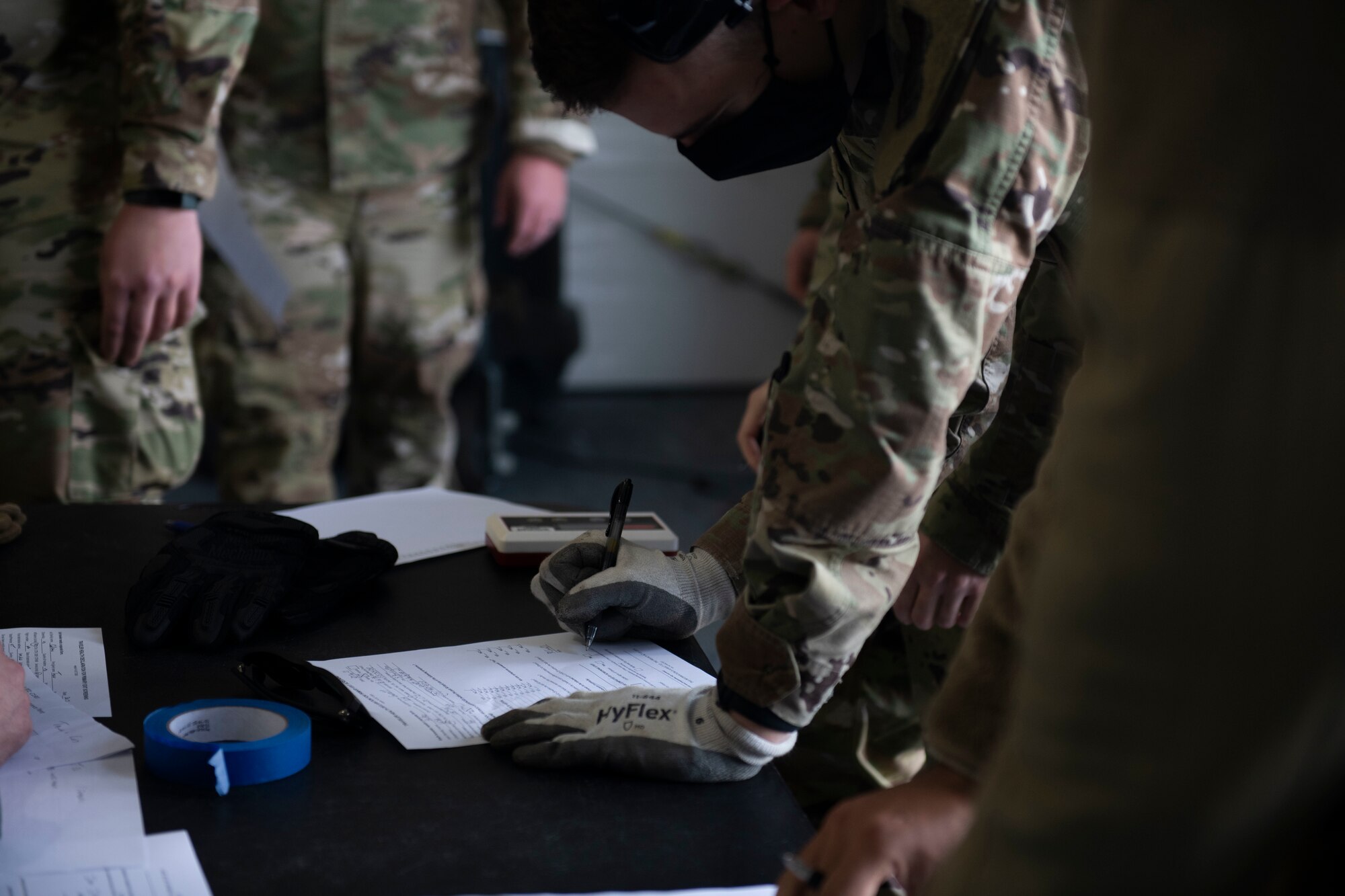 U.S. Air Force Senior Airman Evan Keough, 325th Logistics Readiness Squadron air transportation function journeyman, records the weight of a passenger on Tyndall Air Force Base, Florida, Jan. 30, 2021. The air transportation flight ensures all cargo, including passengers, is air worthy and safe for flight operations. (U.S. Air Force photo by Airman 1st Class Tiffany Price)
