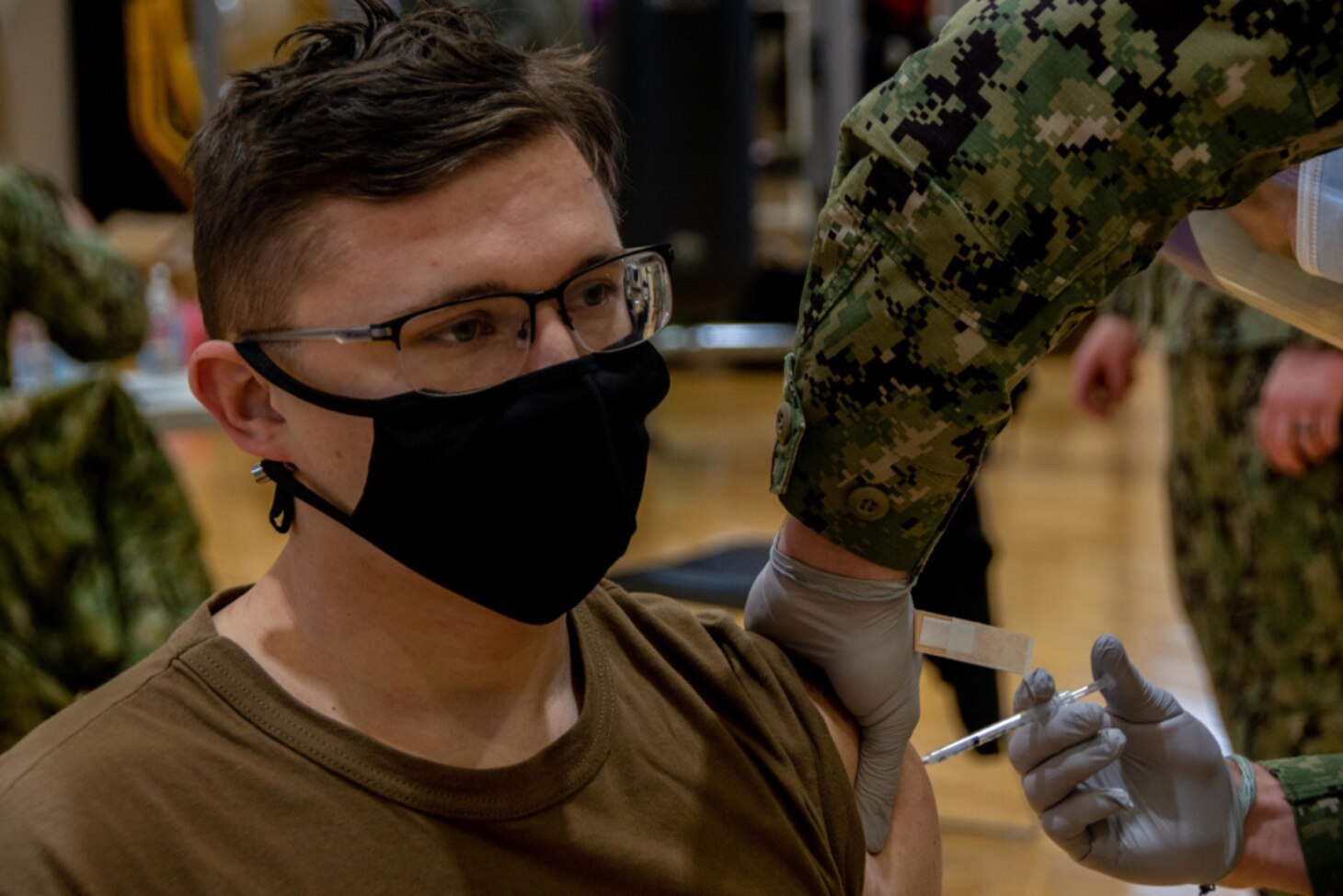 YOKOSUKA, Japan (Feb. 2, 2021) Electronics Technician (Nuclear) Seaman Jakob Ryer, assigned to the U.S. Navy’s only forward-deployed aircraft carrier USS Ronald Reagan (CVN 76), receives the second shot of the COVID-19 vaccine on Commander, Fleet Activities Yokosuka (CFAY). Medical personnel and strategic forces were the first to receive the COVID-19 vaccine. Ronald Reagan returned to Yokosuka in November 2020 following a six-month deployment in the U.S. 7th Fleet area of responsibility.