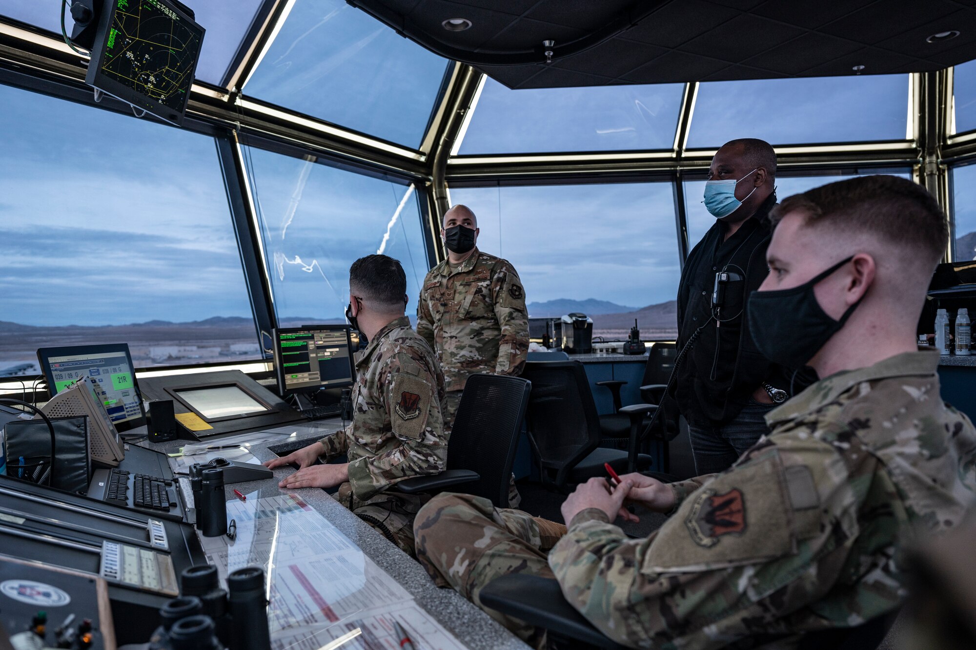 People talking inside a Air Traffic Control Tower