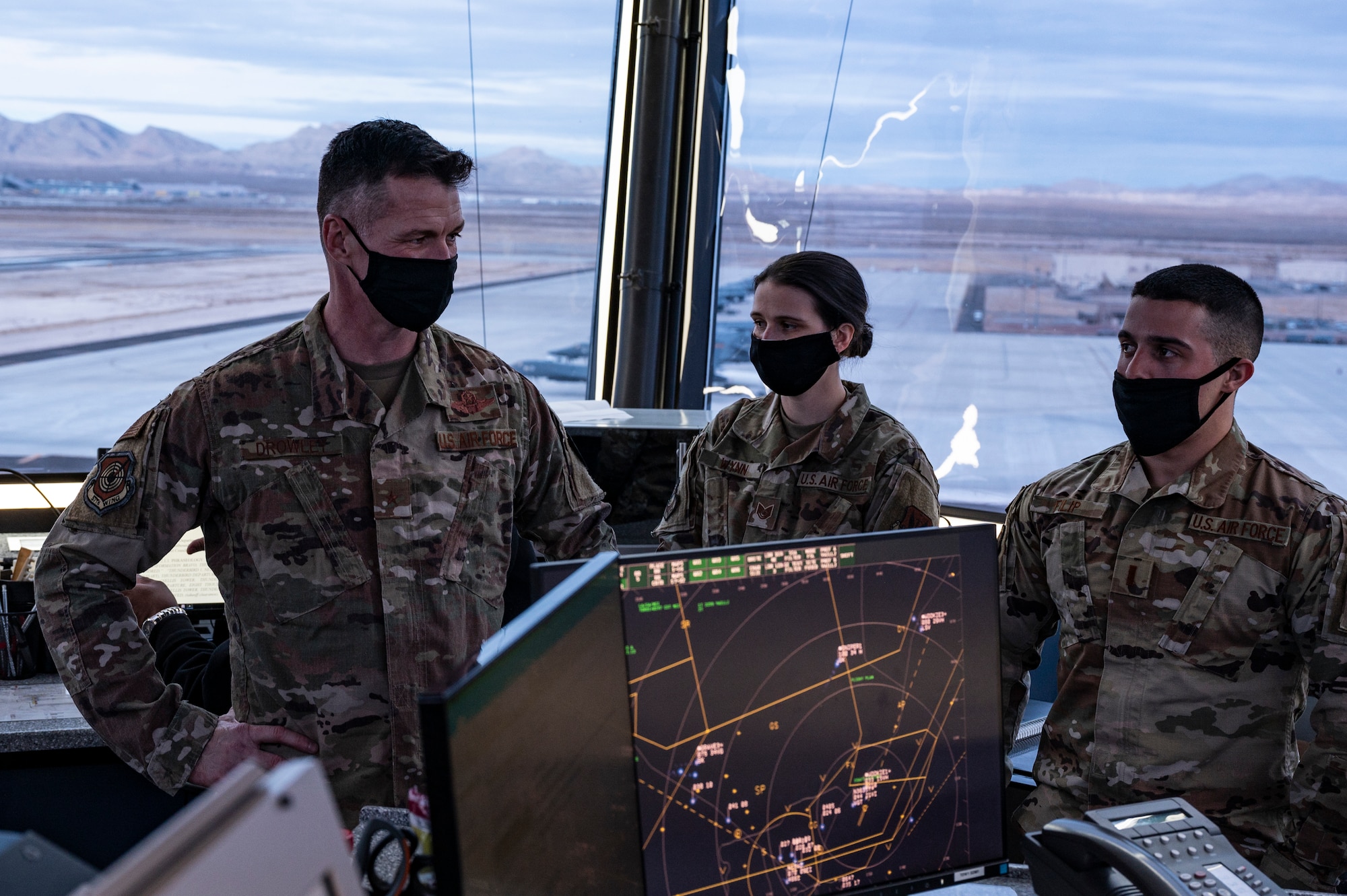 People talking inside a Air Traffic Control Tower