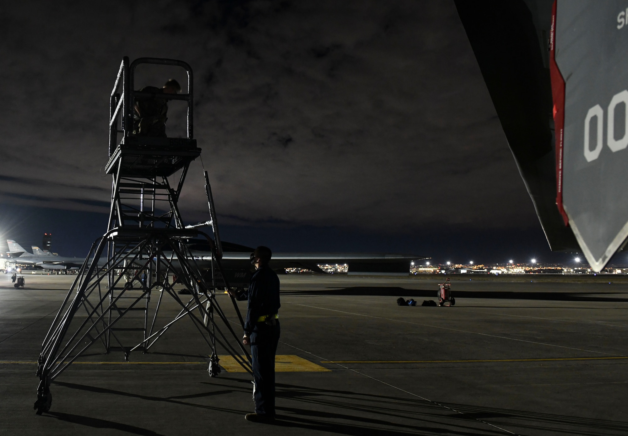 U.S. Air Force Senior Airman Matthew Anderson, left, and Staff Sgt. Sean Cadigan, both 509th Maintenance Squadron signature diagnostics technicians, setup an aircraft standing during Red Flag 21-1, at Nellis Air Force Base, Nevada, Feb. 1, 2021. Along with aircrew, approximately 100 Team Whiteman Airmen participated in the large-force exercise as the lead wing. As the lead Wing, RF 21-1 enabled Team Whiteman to maintain a high state of readiness and proficiency, while validating their always-ready global strike capability. (U.S. Air Force photo by Staff Sgt. Sadie Colbert)