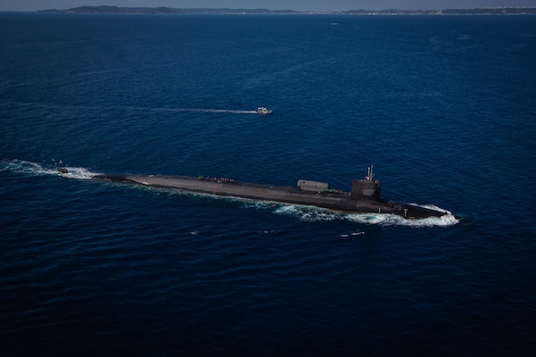 PHILIPPINE SEA (Feb. 2, 2021) The Ohio-class guided-missile submarine USS Ohio (SSGN 726), deployed to U.S. 7th Fleet area of operations, rendezvous with a combat rubber raiding craft, attached to U.S. Marine Corps Force Reconnaissance Company, III Marine Expedition Force (MEF), for an integration exercise off the coast of Okinawa, Japan. The exercise was part of ongoing III MEF-U.S. 7th Fleet efforts to provide flexible, forward-postured and quick response-options to regional commanders. (U.S. Marine Corps photo by Sgt. Audrey M. C. Rampton)