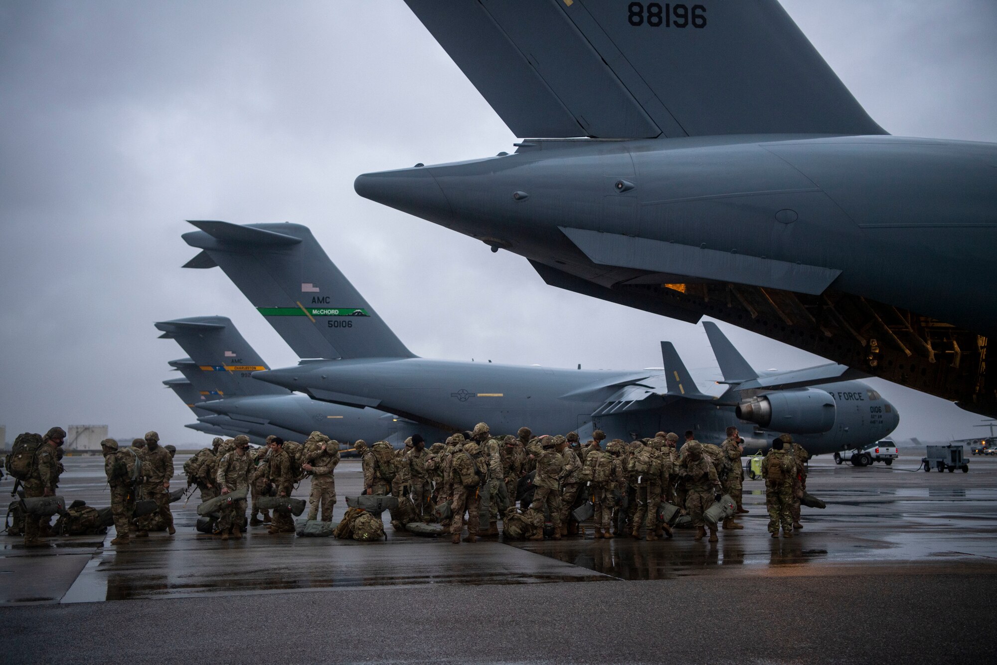 Paratroopers stand near the back of a C-17.