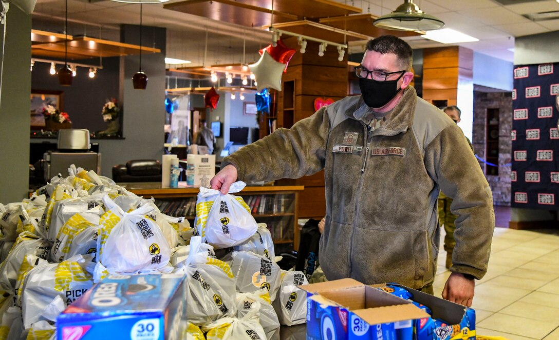 Master Sgt. Bobby Powell, 512th Force Support Squadron wing career assistance advisor, during the United Services Organization’s 80th birthday celebration at Dover Air Force Base, Delaware, Feb. 4, 2021. USO Delaware celebrated its 80th birthday by providing service members a grab and go lunch, dessert and a tailgating essentials raffle. (U.S. Air Force photo by Airman 1st Class Stephani Barge)