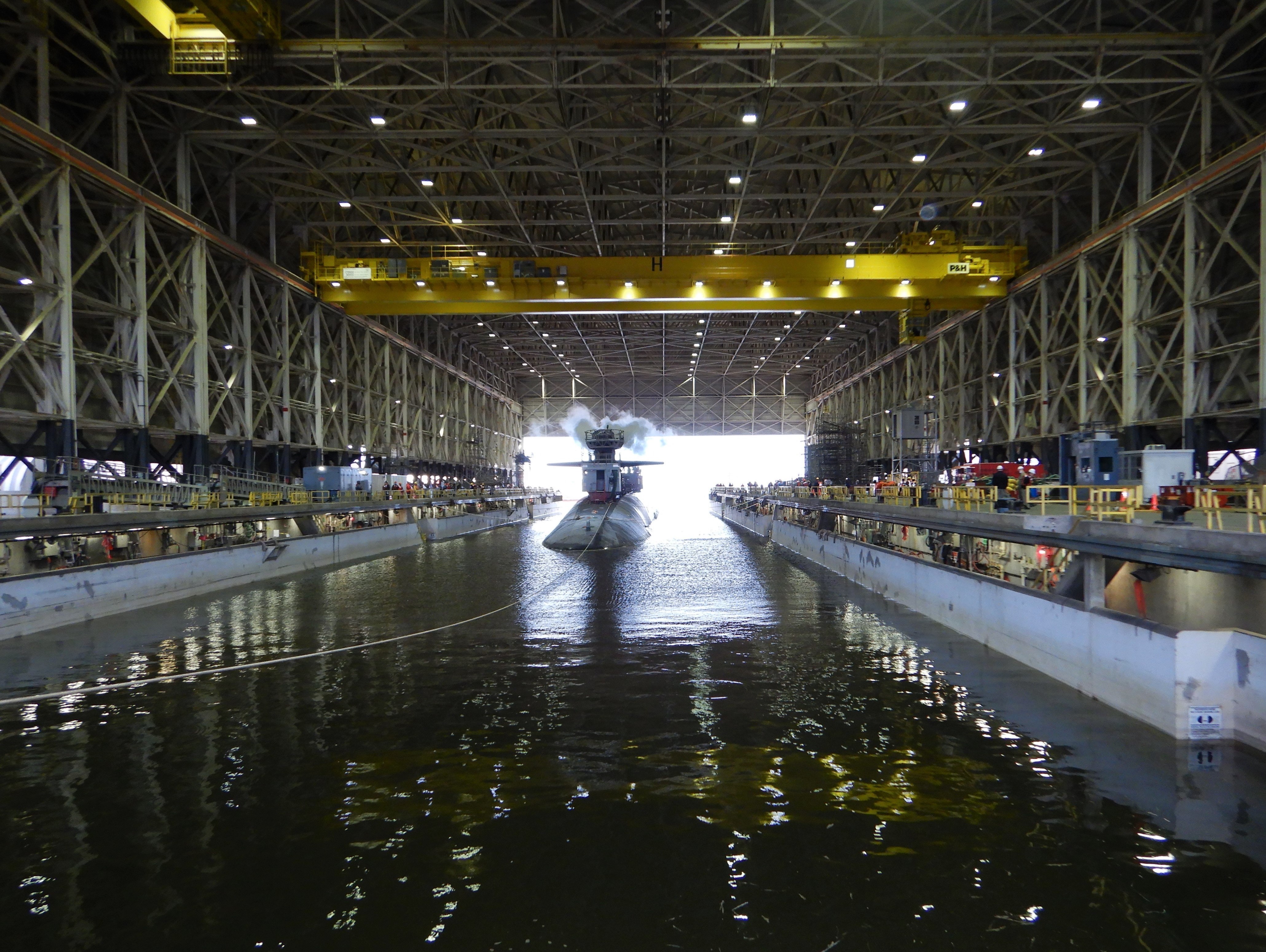 The Ohio-class ballistic-missile submarine USS Tennessee (SSBN 734) enters the Trident Refit Facility, Kings Bay, Ga., dry dock Feb. 1, 2021, for an extended refit period (ERP).