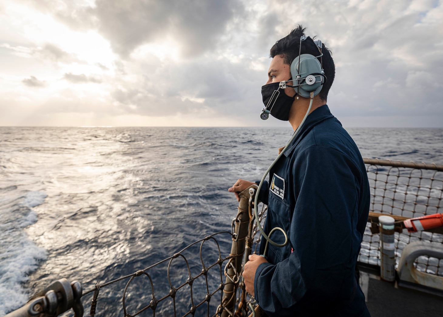 PARACEL ISLANDS, SOUTH CHINA SEA (Feb. 05, 2021) Seaman Recruit Richard Lopez, from Tulare, Calif., stands watch as aft lookout on the flight deck aboard the Arleigh Burke-class guided-missile destroyer USS John S. McCain (DDG 56) as the ship conducts routine underway operations. McCain is forward-deployed to the U.S. 7th Fleet area of operations in support of security and stability in the Indo-Pacific region. (U.S. Navy photo by Mass Communication Specialist 2nd Class Markus Castaneda)