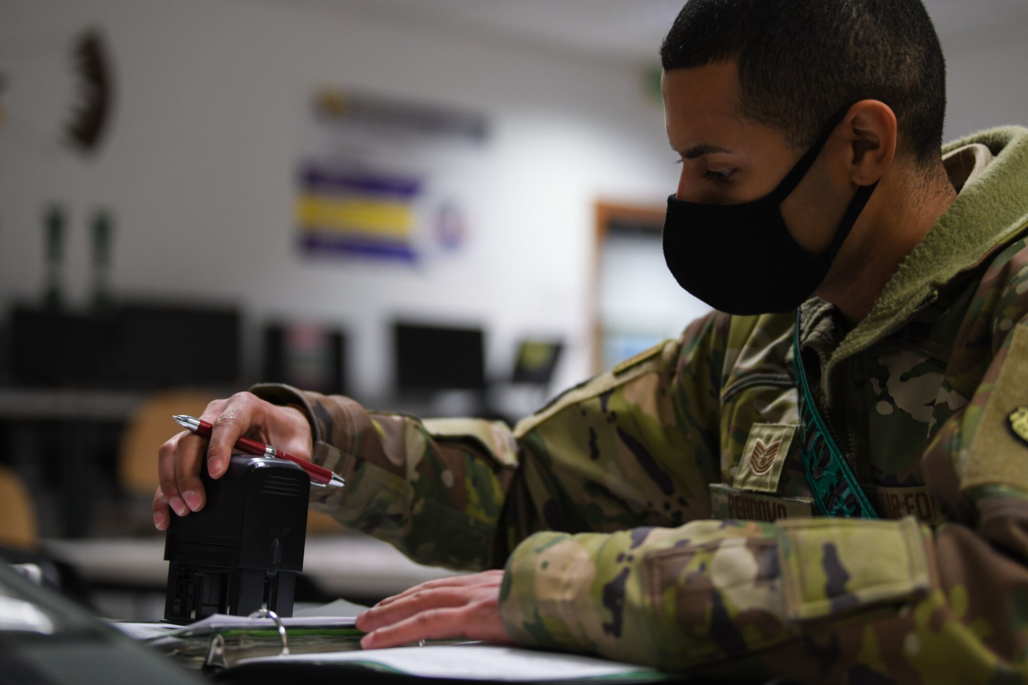 U.S. Air Force Tech. Sgt. Ronelson Perdomo, 31st Aircraft Maintenance Squadron, 555th Aircraft Maintenance Unit, noncommissioned officer in charge, stamps an F-16 Fighting Falcon form at Aviano Air Base, Italy, Feb. 1, 2021. The 31st AMXS supports the 31st Fighter Wing, U.S. Air Forces in Europe and NATO contingency and combat aircraft maintenance requirements. (U.S. Air Force photo by Senior Airman Ericka A. Woolever)