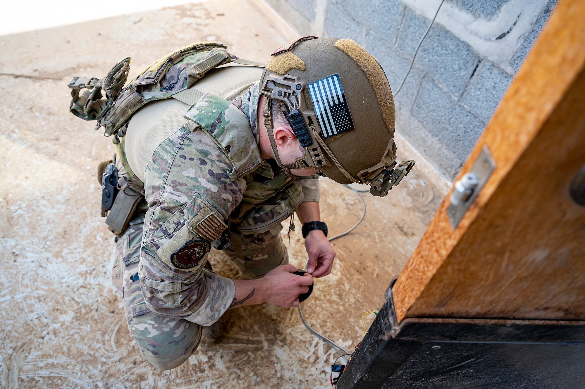 U.S. Air Force Staff Sgt. Ryan Melody, 380th Expeditionary Civil Engineer Squadron explosive ordnance disposal (EOD) technician, defuses a simulated explosive during a joint training event at Al Dhafra Air Base, United Arab Emirates, Jan. 28, 2021.