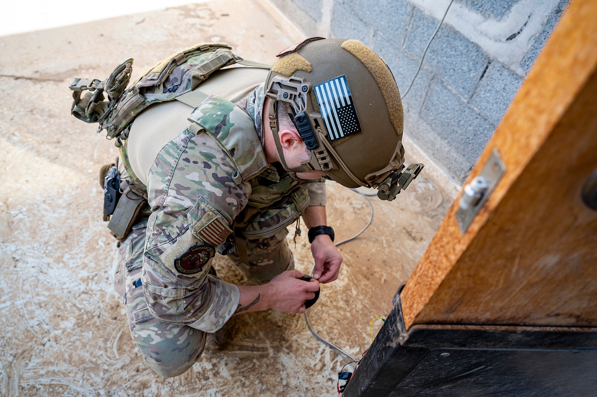 U.S. Air Force Staff Sgt. Ryan Melody, 380th Expeditionary Civil Engineer Squadron explosive ordnance disposal (EOD) technician, defuses a simulated explosive during a joint training event at Al Dhafra Air Base, United Arab Emirates, Jan. 28, 2021.