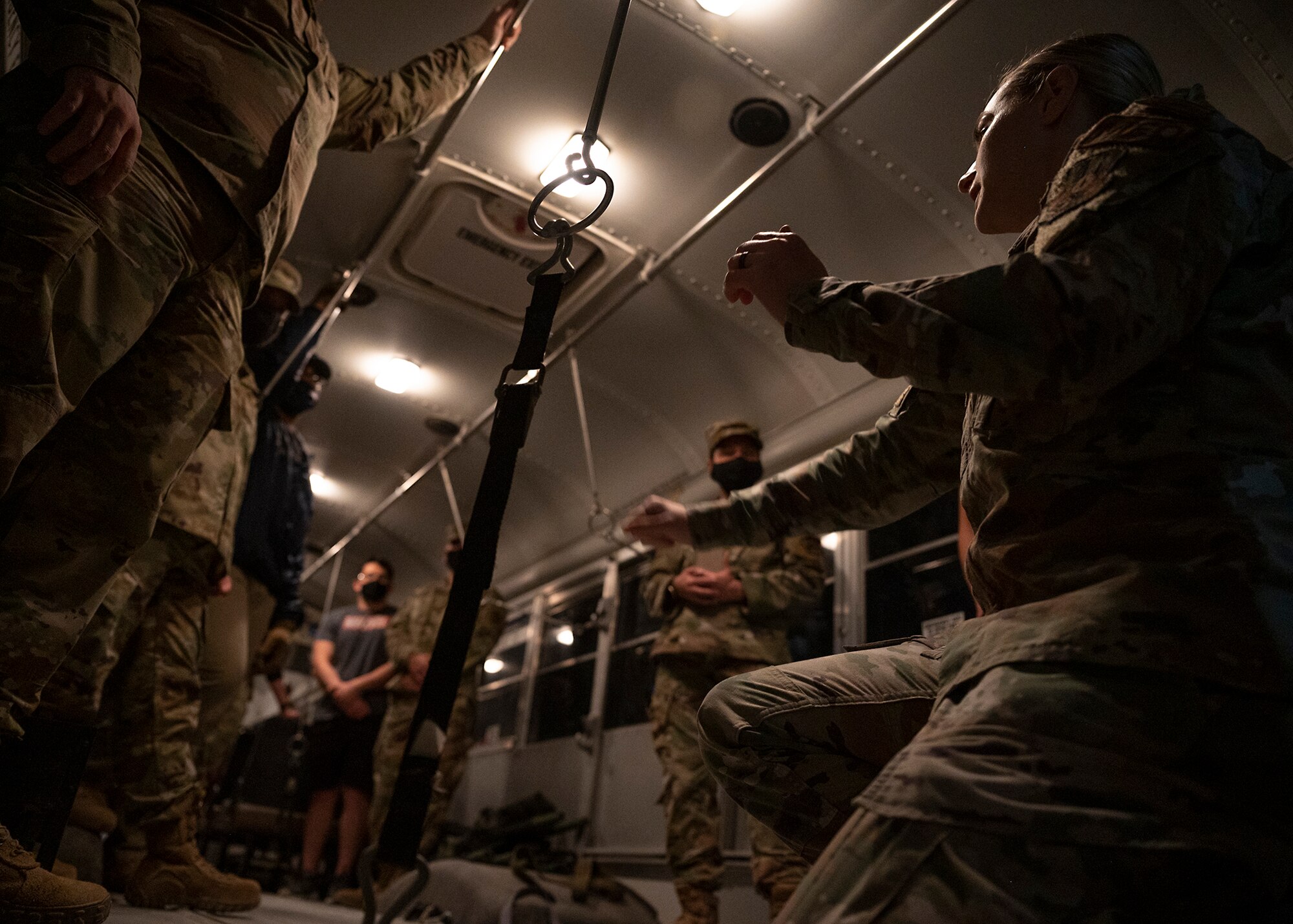 Participants in the 380th Air Expeditionary Wing (AEW) Honorary Members Program learn how to properly secure stretchers inside an ambulance bus during a 380th Expeditionary Medical Group (EMDG) immersion event at Al Dhafra Air Base, United Arab Emirates, Jan. 28, 2021.