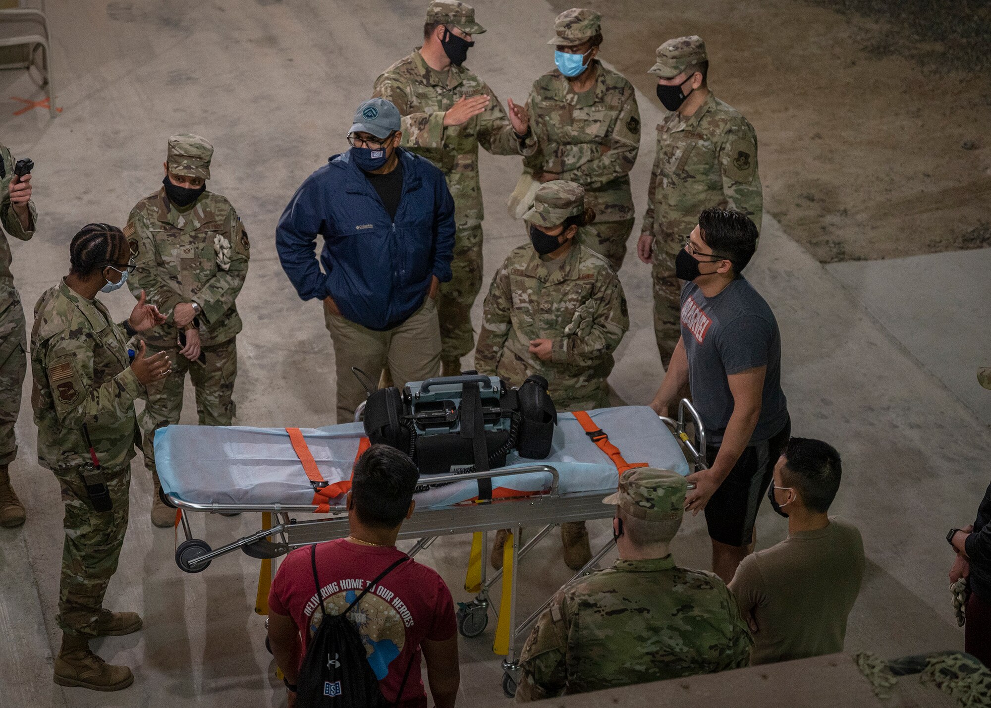 Participants in the 380th Air Expeditionary Wing Honorary Members Program learn proper stretcher procedures during a 380th Expeditionary Medical Group (EMDG) immersion event at Al Dhafra Air Base, United Arab Emirates, Jan. 28, 2021.