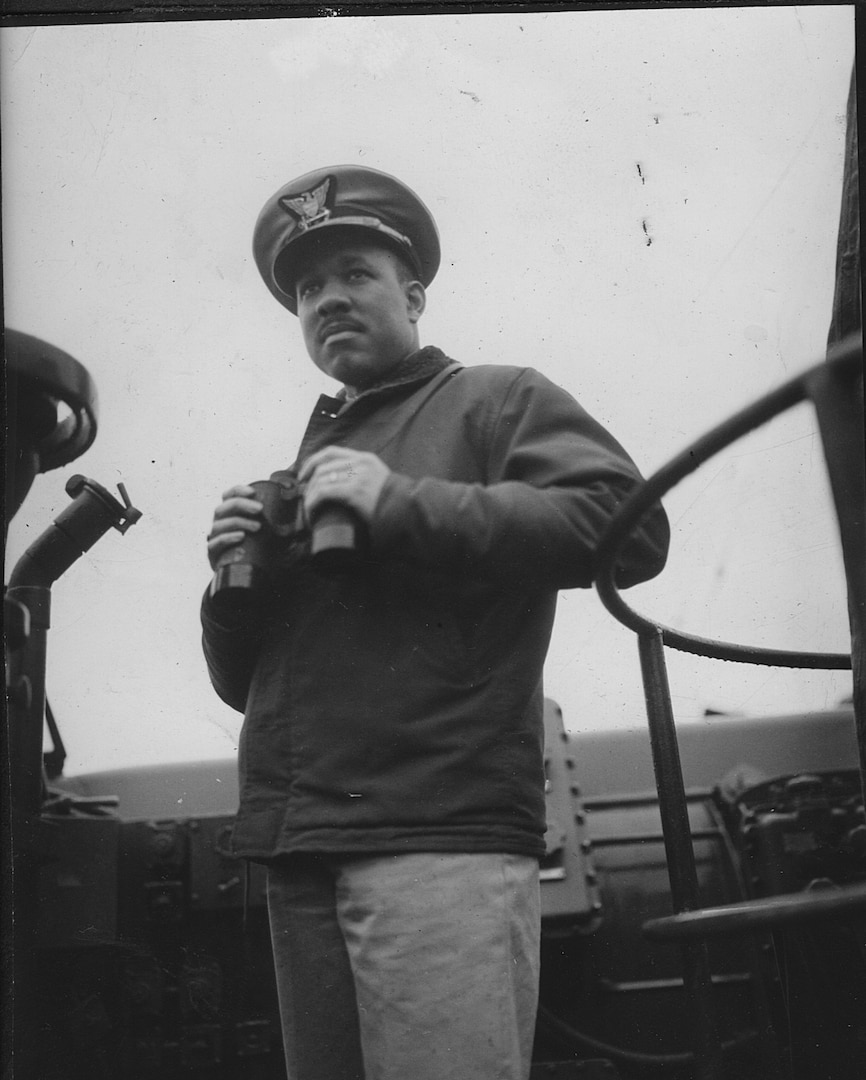 8.	Lt.j.g. Joseph Jenkins on the bridge late in World War II. (photo courtesy of the Jenkins Family)