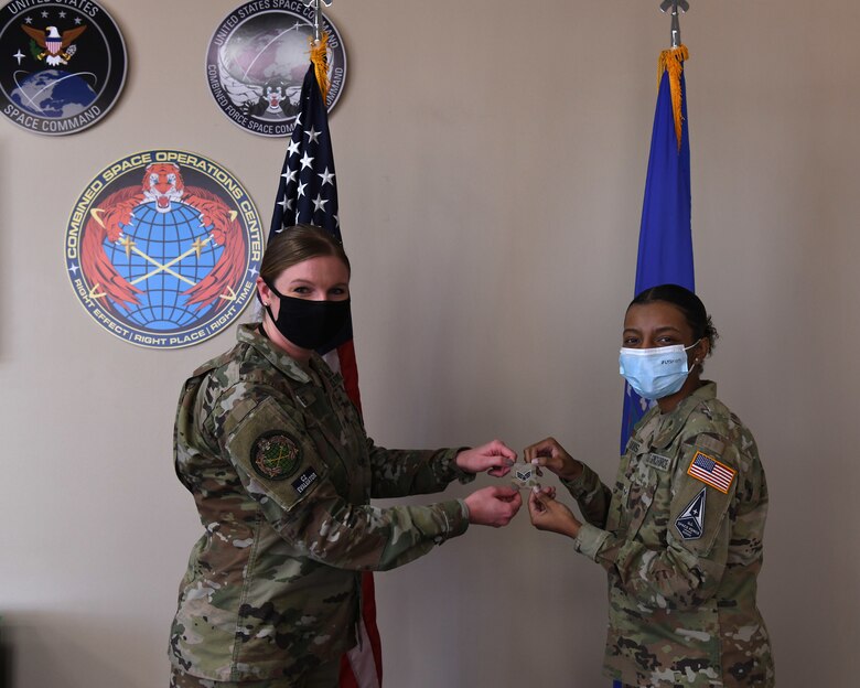 Specialist 3 Quinaeja Davis, Delta 5 space systems operator, prepares for her promotion to Specialist 4 prior to her promotion ceremony Feb. 5, 2021, at Vandenberg Air Force Base, Calif.