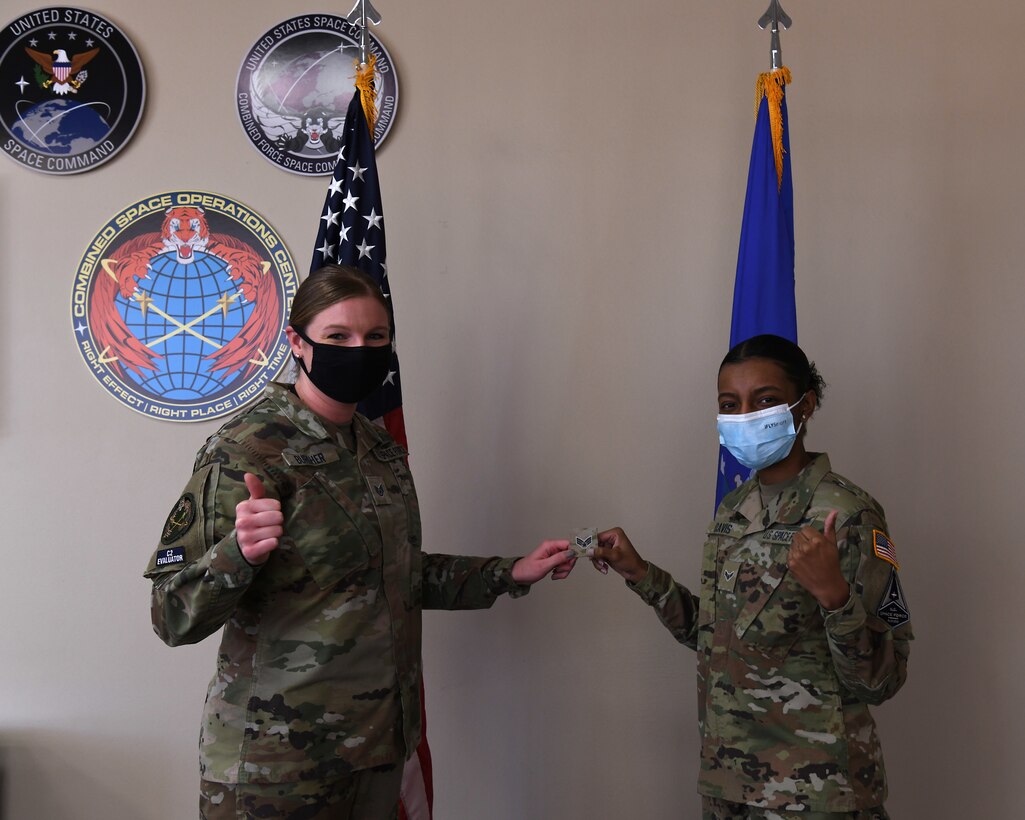 Specialist 3 Quinaeja Davis, Delta 5 space systems operator, prepares for her promotion to Specialist 4 prior to her promotion ceremony Feb. 5, 2021, at Vandenberg Air Force Base, Calif.