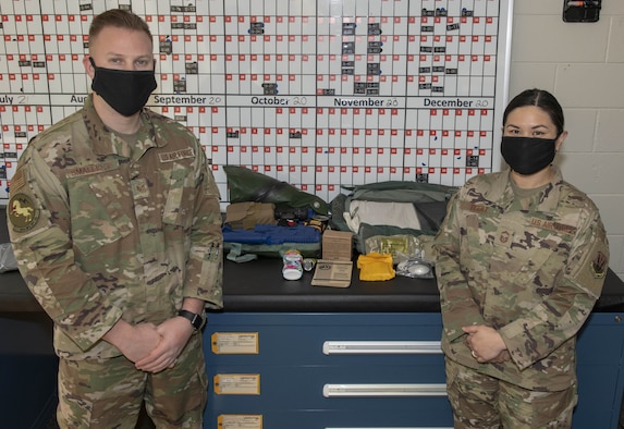 Photo of Airmen with survival kit.