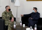 Rear Adm. Anthony Carullo, Deputy Commander, U.S. Sixth Fleet, visits with Italian Navy Capt. Vascello Aniello Cuiciniello, Commandant of the Marina di Napoli Headquarters, during a coordinated assessment of the Campania region ports, Feb. 4, 2021.