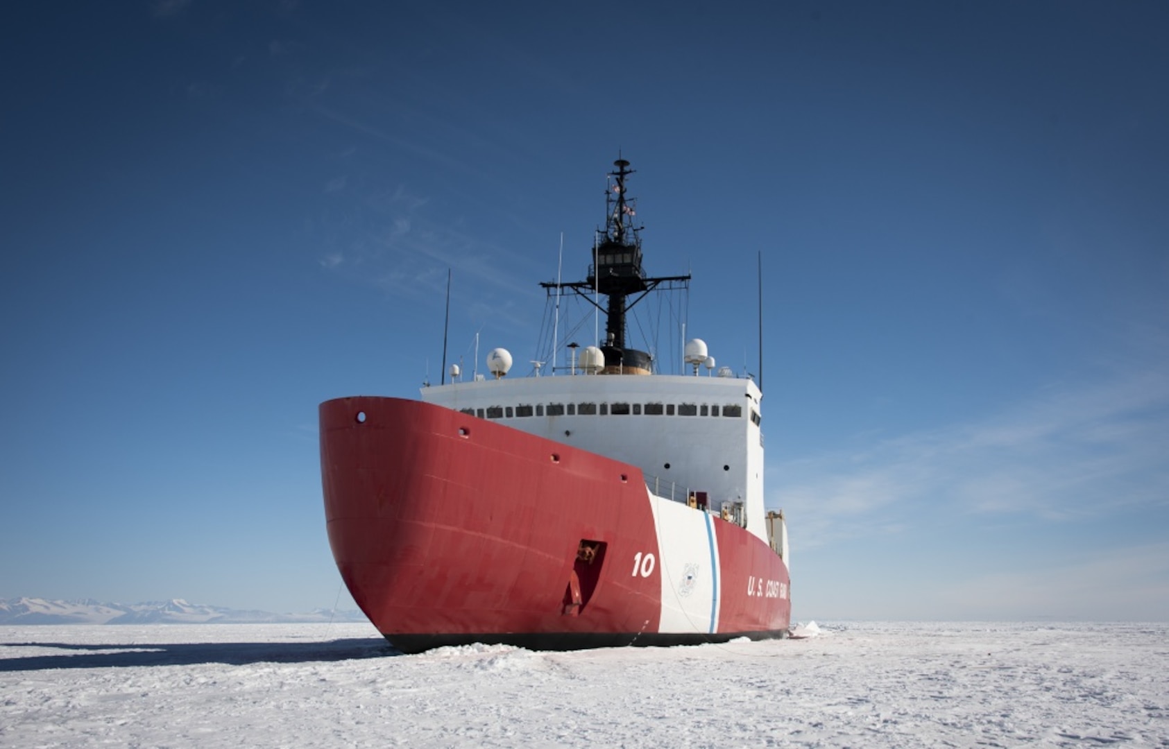 The Coast Guard Cutter Polar Star (WAGB-10) is in the fast Ice Jan. 2, 2020, approximately 20 miles north of McMurdo Station, Antarctica. The 399-foot icebreaker is the only ship in U.S. service capable of clearing a path through the Antarctic ice to escort three refuel and resupply ships to McMurdo Station during Operation Deep Freeze. The ships deliver enough cargo and fuel to sustain year-round operations on the remote continent. U.S. Coast Guard photograph by Senior Chief Petty Officer NyxoLyno Cangemi