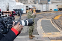 Visual Information Specialist Greg Boyd captures footage as Capt. Dianna Wolfson surprises members of the Contracts Department (Code 400), Operations Department (Code 300) and Business Office (Code 1200) who worked an urgent contract for cleaning the sanitary tanks for USS Pasadena (SSN 752). She surprised the awardees on site at the Pasadena as part of the first episode of America’s Shipyard to recognize them for their efforts and to hear from them personally about what drives them each day as they serve America’s Shipyard.