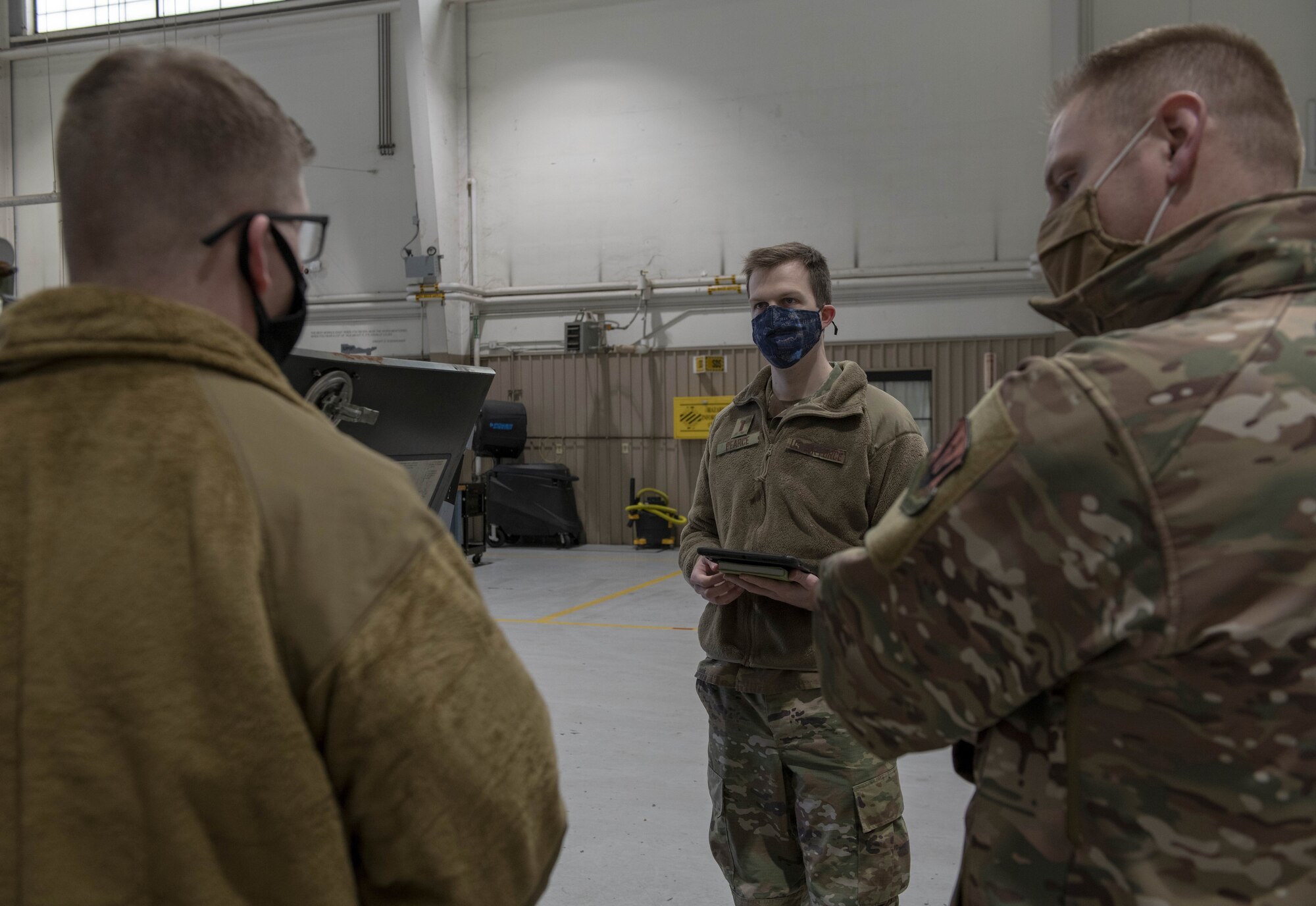 Photo of Airmen speaking.