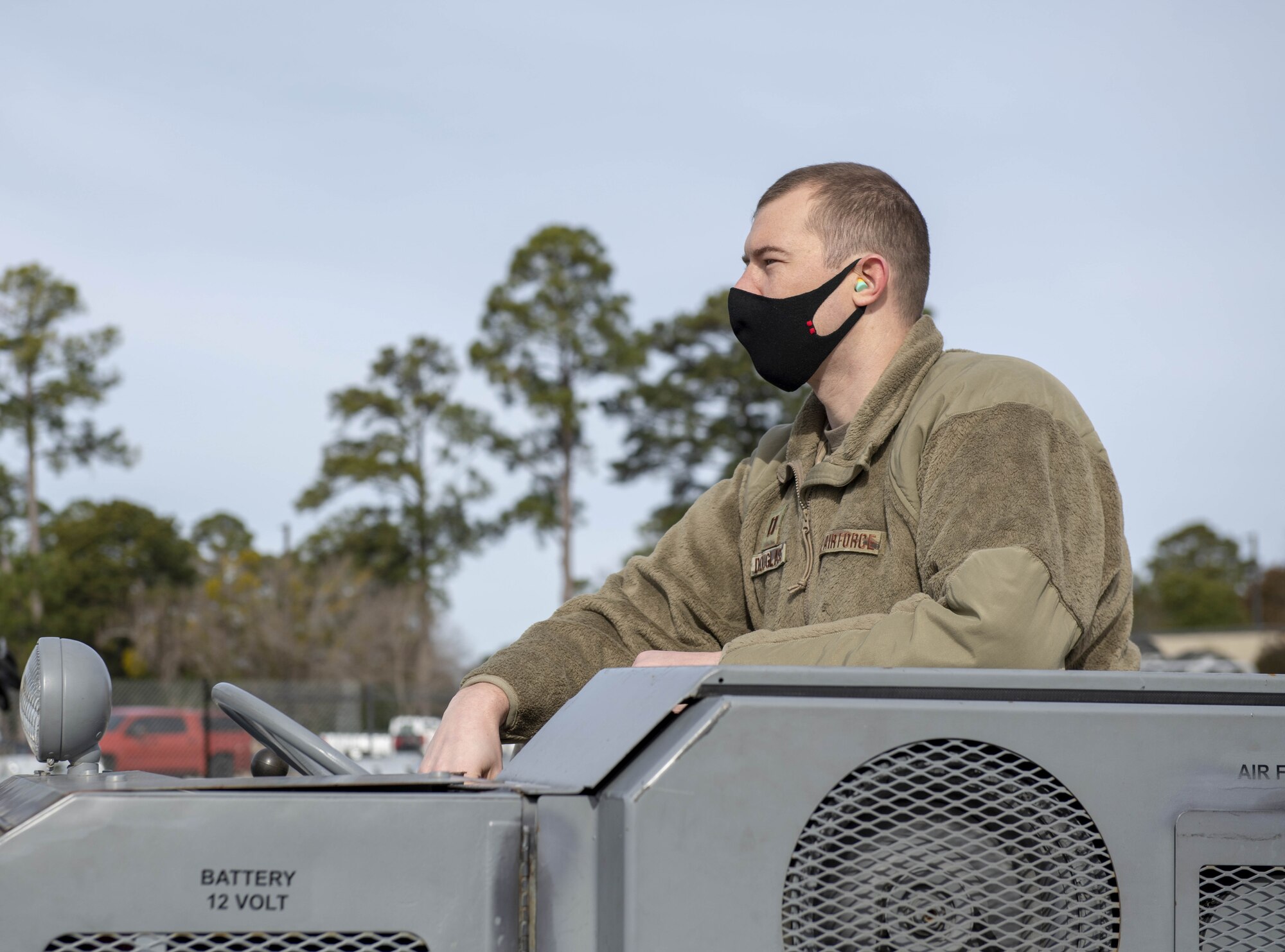 Photo of an Airman operating a vehicle.